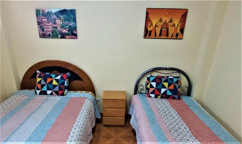 Ένα ή περισσότερα κρεβάτια σε δωμάτιο στο Carlos Guest House 1 Cusco