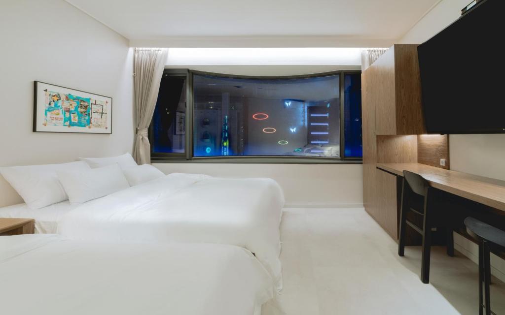 Postel nebo postele na pokoji v ubytování Aank Hotel Wolgot