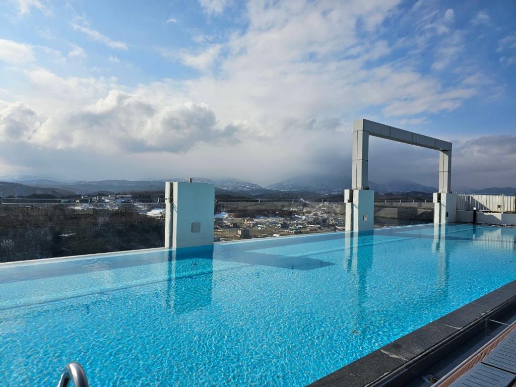 a large swimming pool on top of a building at Le Bleu Naksan by Chestertons in Yangyang