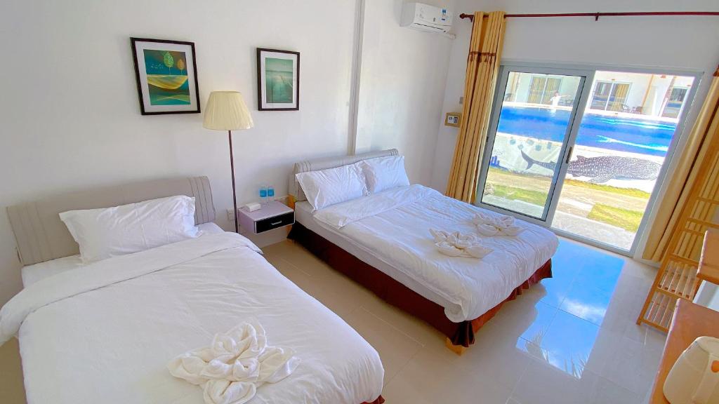 Postel nebo postele na pokoji v ubytování Green Mango Resort