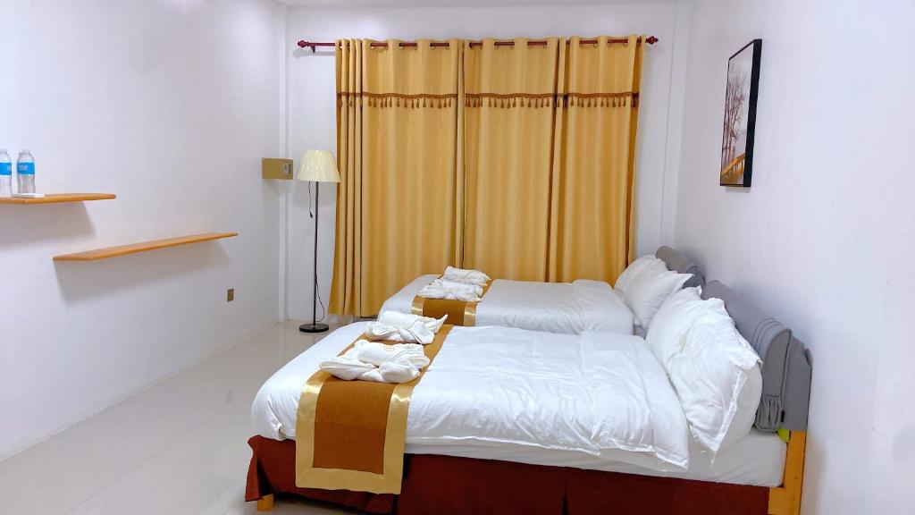 Postel nebo postele na pokoji v ubytování Green Mango Resort