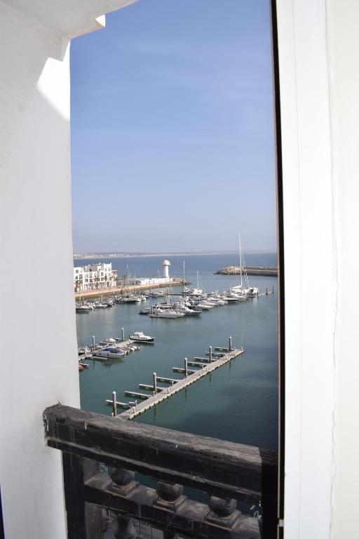 a view of a marina from a window at Marina Agadir Royal Apartment in Agadir