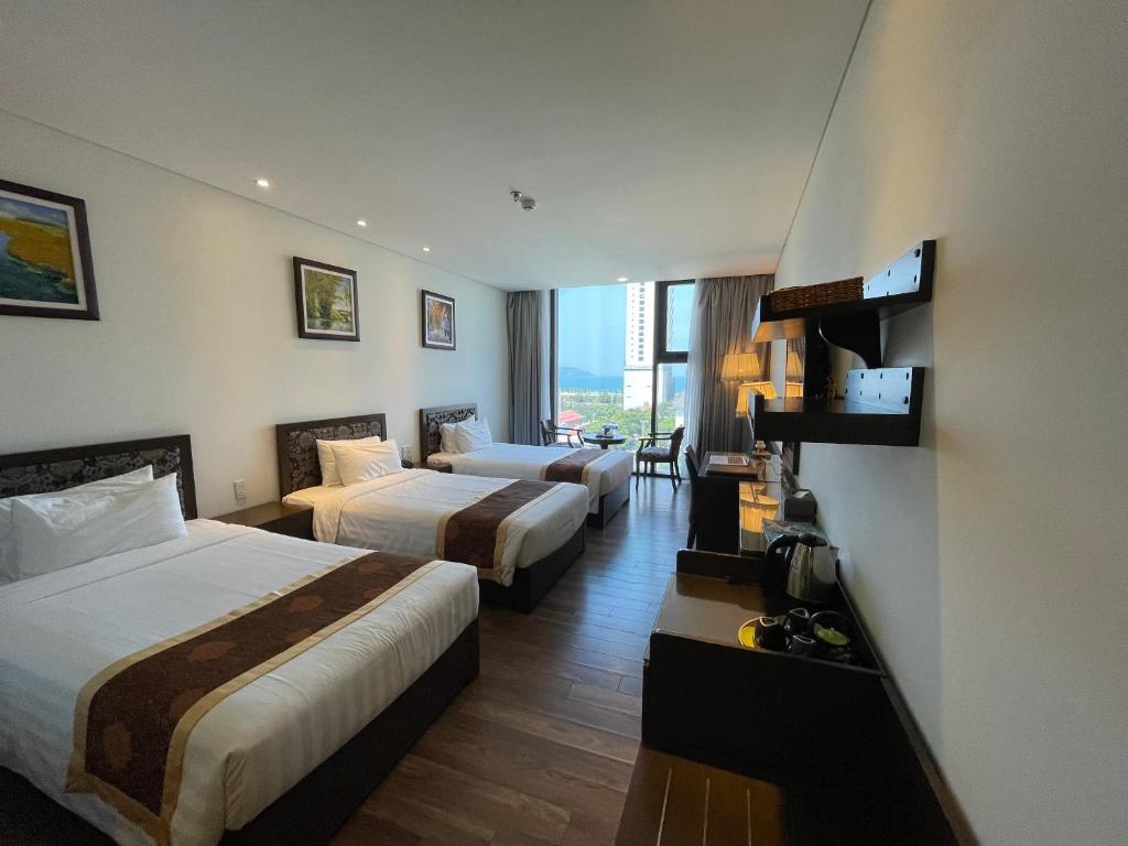 Postel nebo postele na pokoji v ubytování Danaciti Hotel
