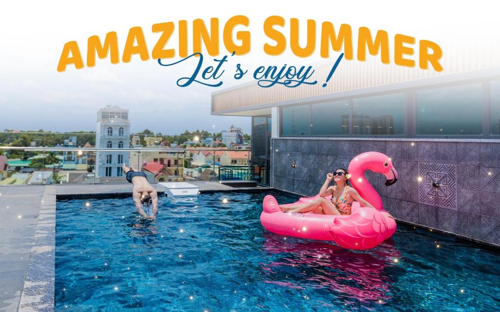 a group of people in the swimming pool on an amaze summer let s enjoy at Bcons PS Hotel and Apartment- Newly Opened Hotel in Bien Hoa