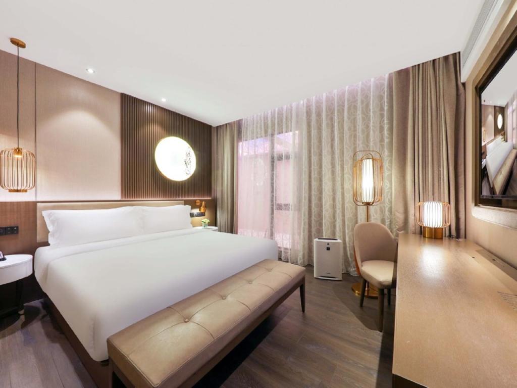 Postel nebo postele na pokoji v ubytování Crystal Orange Hotel - Shanghai The Bund Jinling East Road