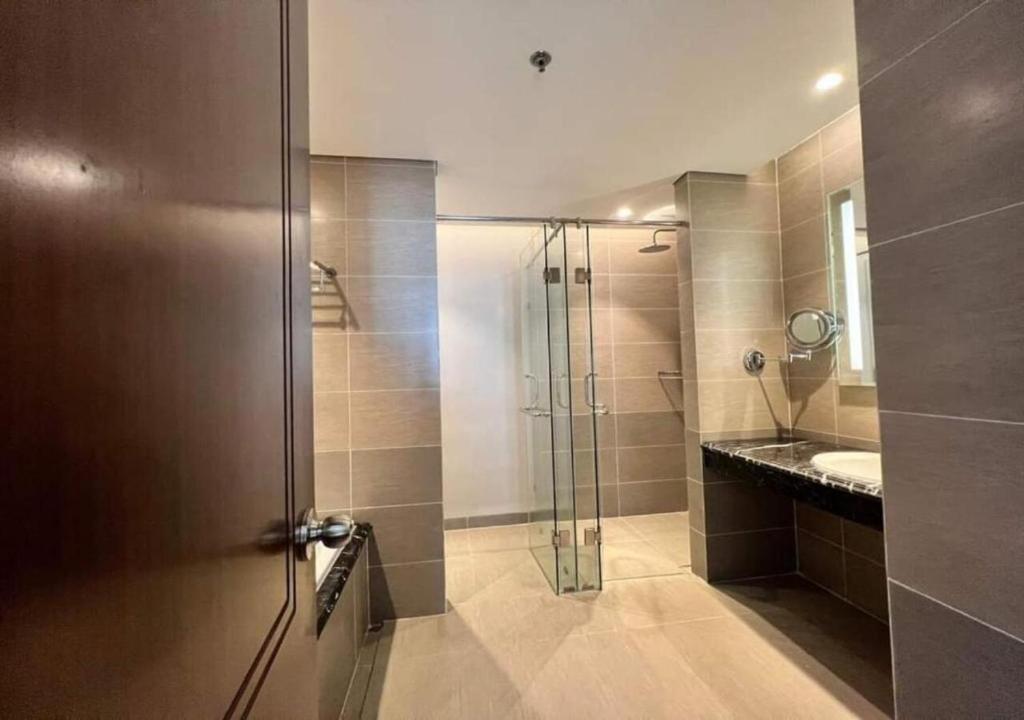 a bathroom with a shower and a sink at Apartment with Ocean view in Danang