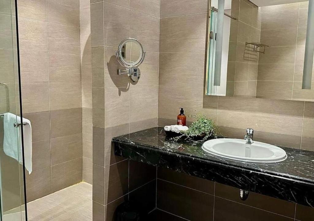 a bathroom with a sink and a mirror at Apartment with Ocean view in Danang