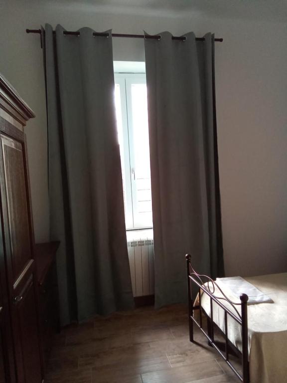 Postel nebo postele na pokoji v ubytování LOCANDA DEI FOLLI