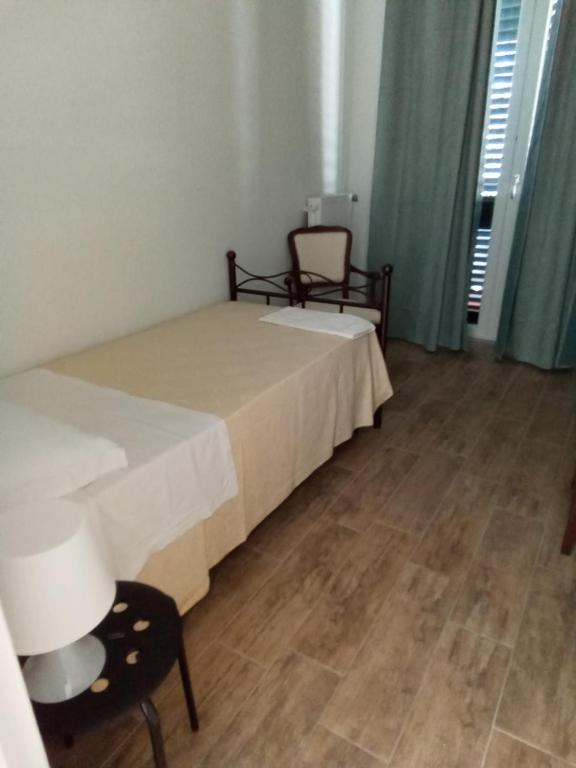 Postel nebo postele na pokoji v ubytování LOCANDA DEI FOLLI