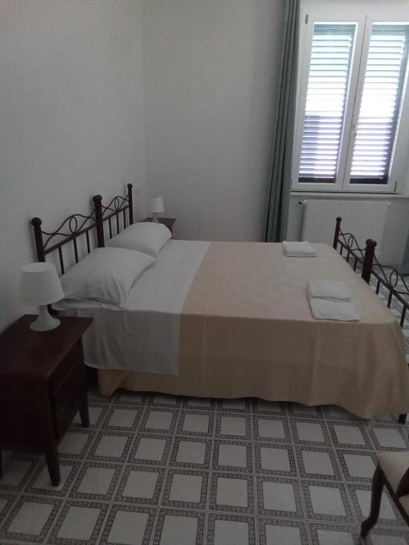 Postel nebo postele na pokoji v ubytování LOCANDA DEI FOLLI