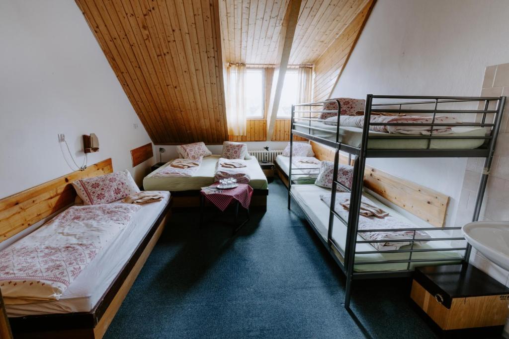 Postel nebo postele na pokoji v ubytování Sova tourist B&B