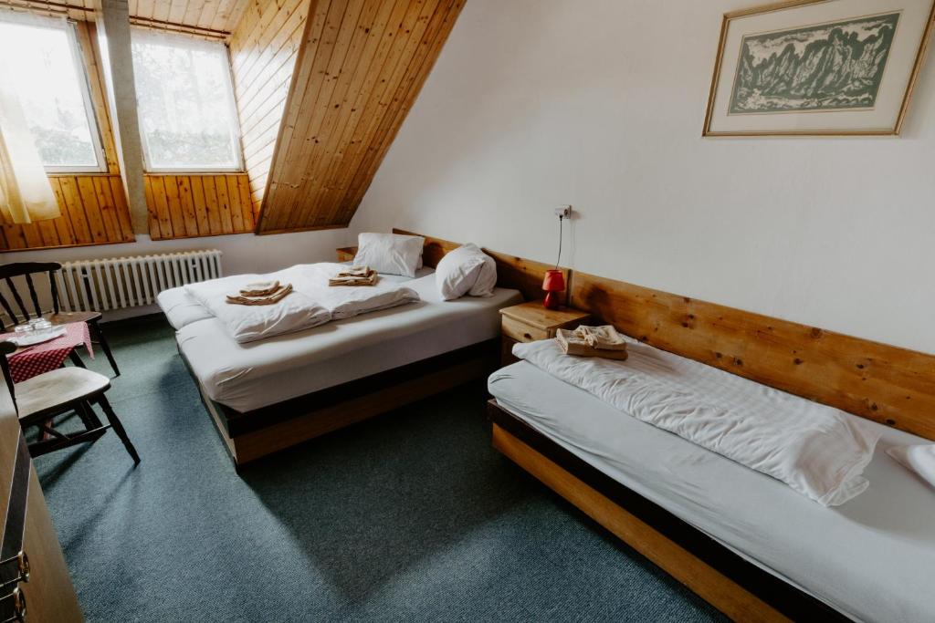 Postel nebo postele na pokoji v ubytování Sova tourist B&B