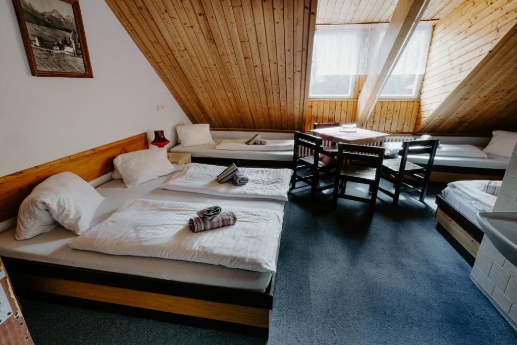 Postel nebo postele na pokoji v ubytování Sova tourist B&B