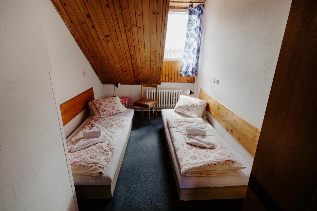 Postel nebo postele na pokoji v ubytování Sova tourist B&B