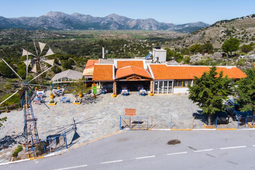 an aerial view of a house and a windmill at Skapani's House in Mésa Lasithákion