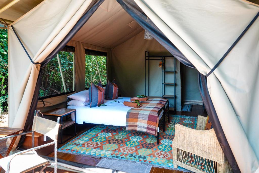 Säng eller sängar i ett rum på Hutwini Camp - Pafuri Walking Safaris