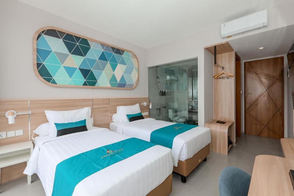 Postel nebo postele na pokoji v ubytování Azana Style Hotel Tulungagung