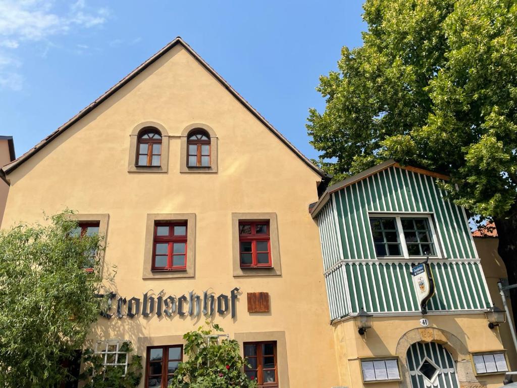 a building with a sign on the side of it at Trobischhof in Dresden