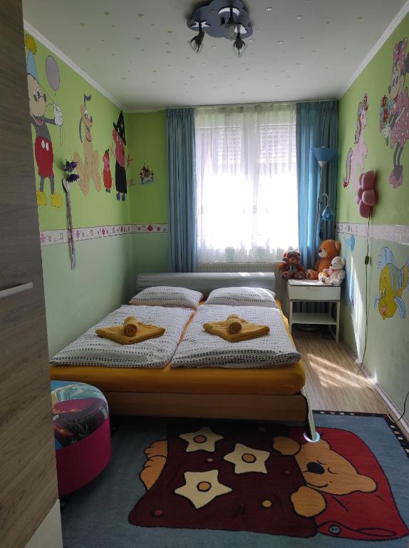 Posteľ alebo postele v izbe v ubytovaní Szofi Vendégház