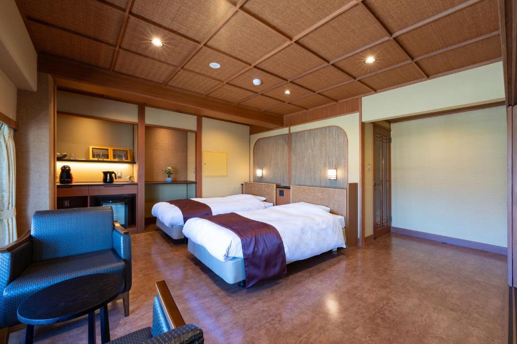 Postel nebo postele na pokoji v ubytování Hotel Sekitei