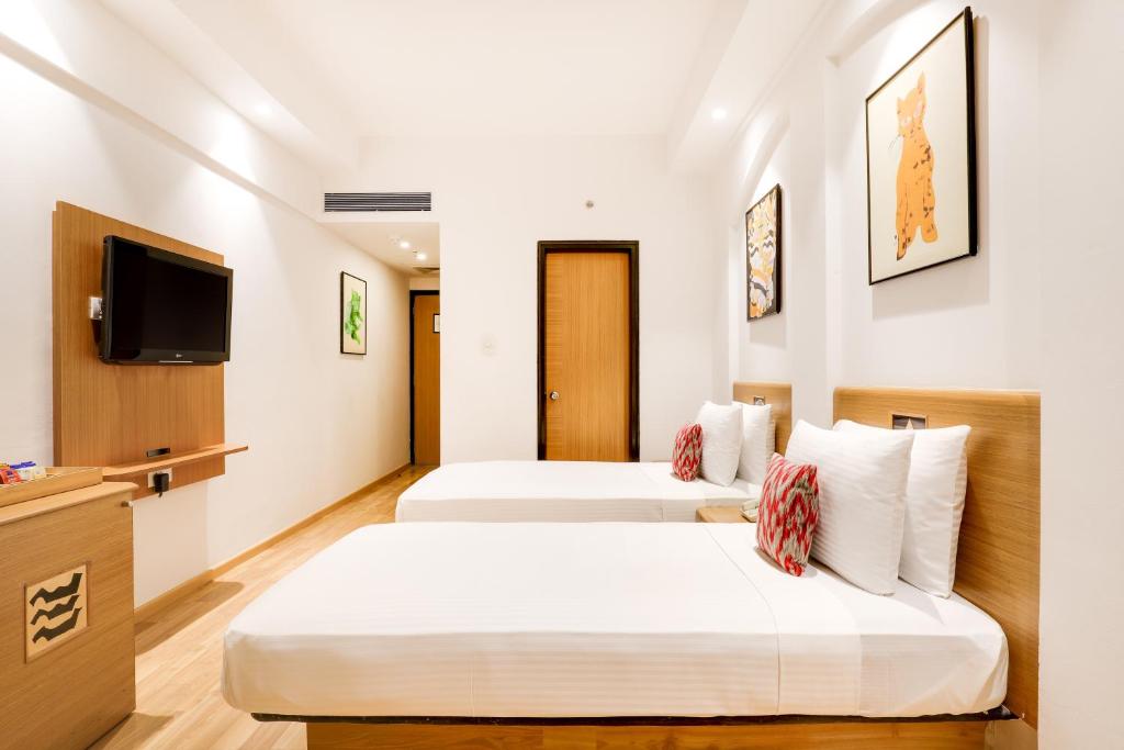 Postel nebo postele na pokoji v ubytování Lemon Tree Hotel Chandigarh