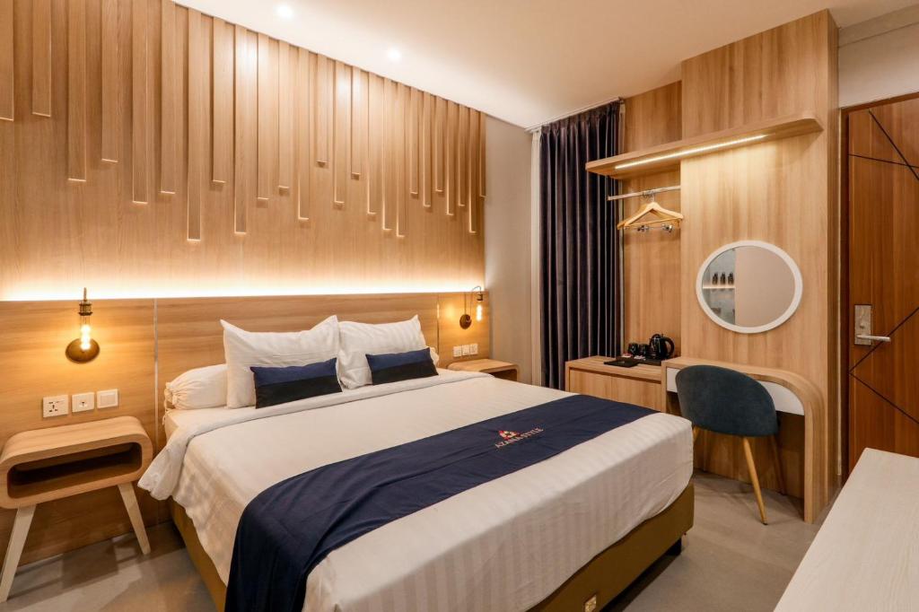 En eller flere senger på et rom på Azana Style Hotel Tulungagung