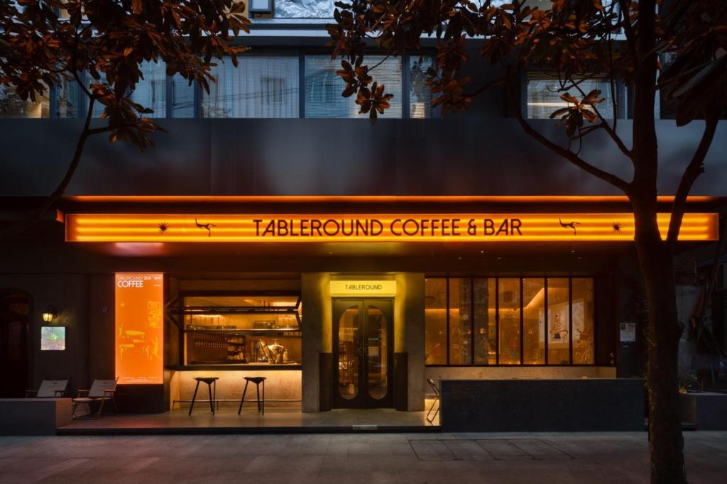 a tea board cafe and bar at night at Tableround in Chengdu