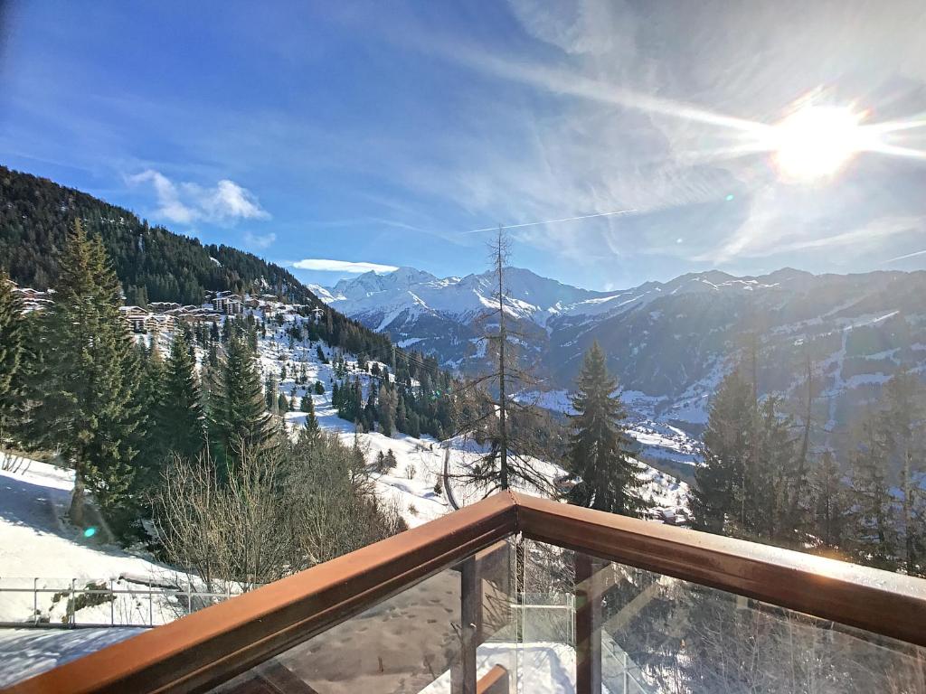 a balcony with a view of a snow covered mountain at Apartment Mondzeu D034 in Verbier