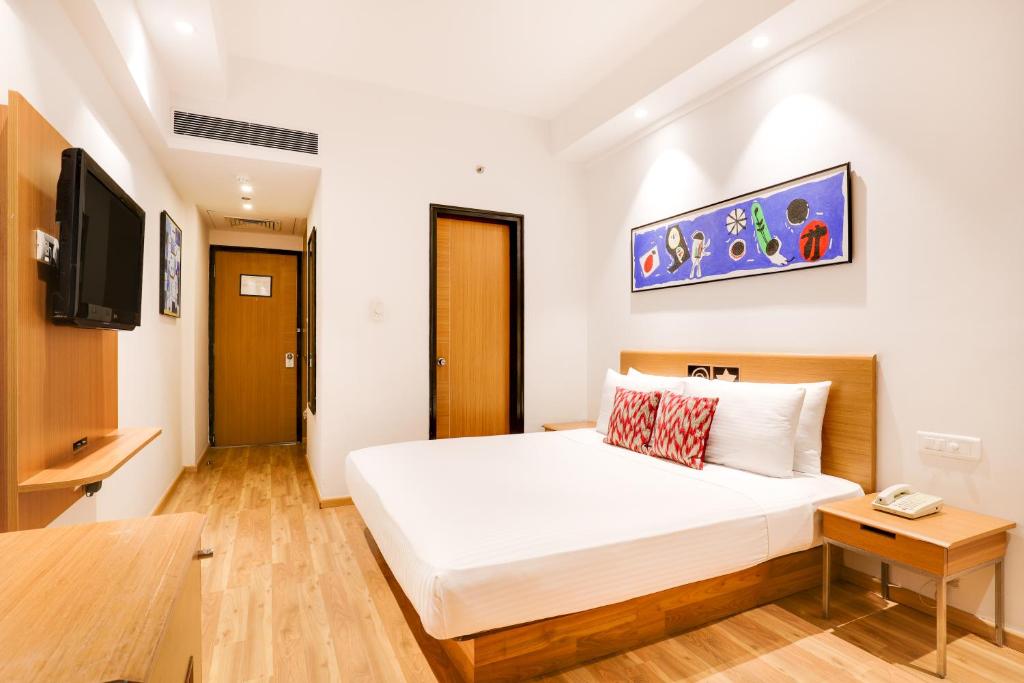 Postel nebo postele na pokoji v ubytování Lemon Tree Hotel Chandigarh
