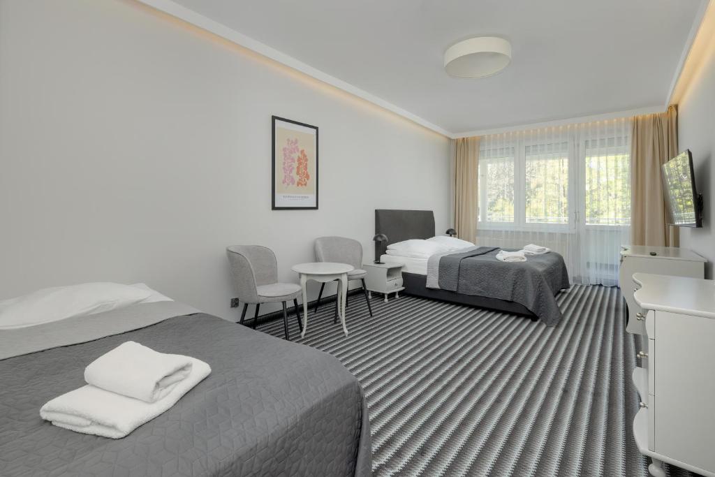 Posteľ alebo postele v izbe v ubytovaní Aparthotel Etna