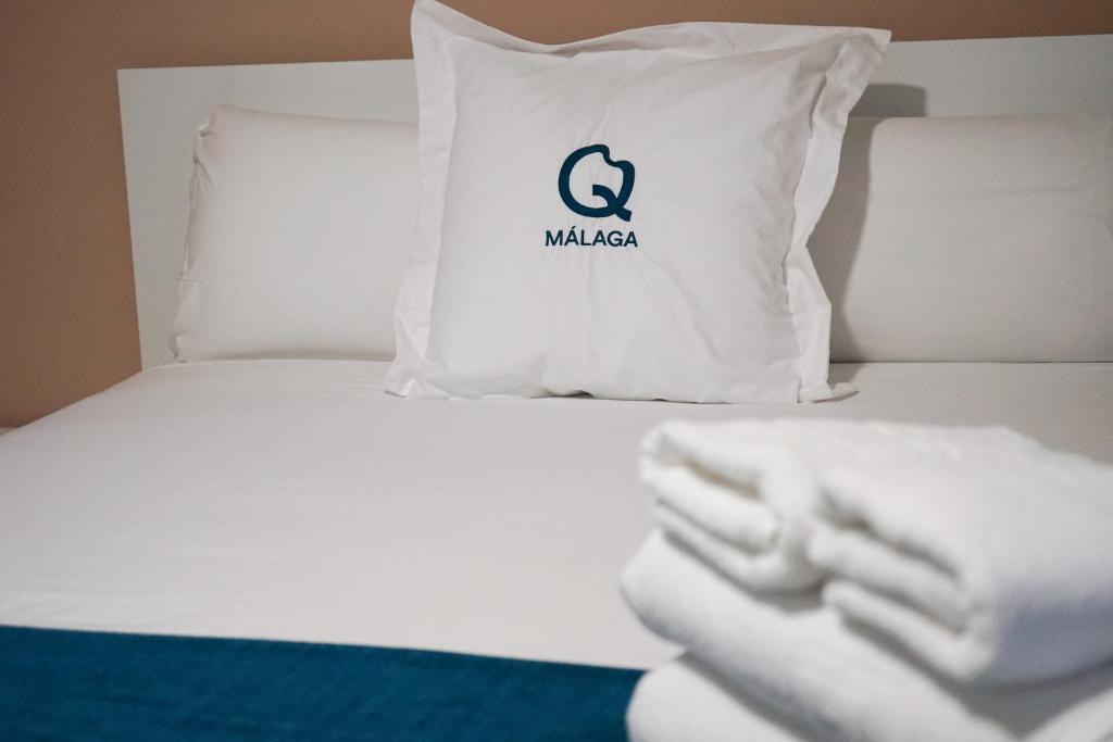 Posteľ alebo postele v izbe v ubytovaní Aqua Apartments Málaga
