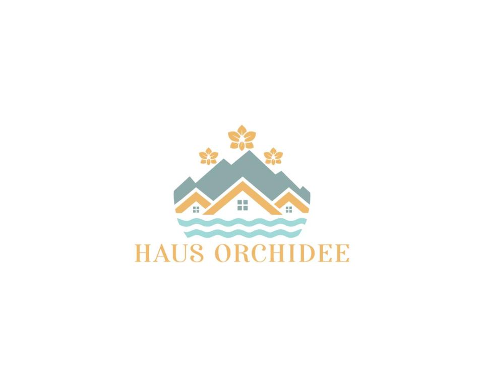 ein Logo für ein Haus mitten im Ozean in der Unterkunft Haus Orchidee in Seline