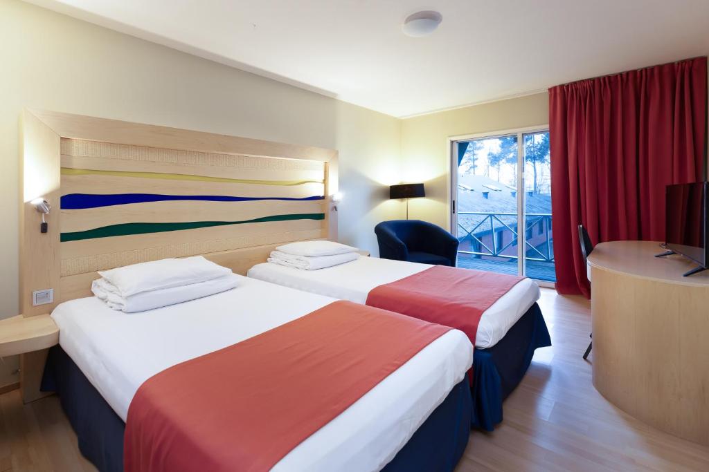 Postel nebo postele na pokoji v ubytování Peoleo Hotell