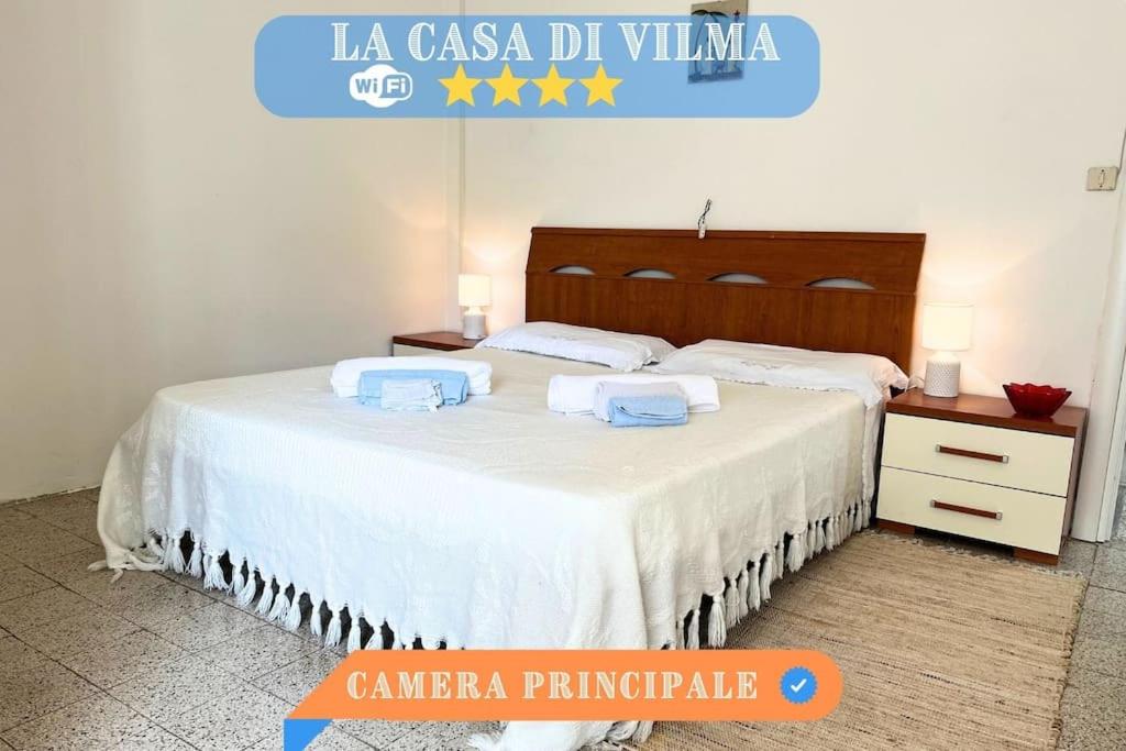 Säng eller sängar i ett rum på La casa di Wilma