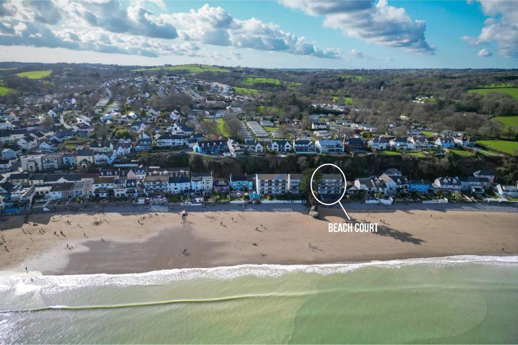 an aerial view of a beach with a ferris wheel at 36 Beach Court - 1 Bed Apartment - Saundersfoot in Saundersfoot