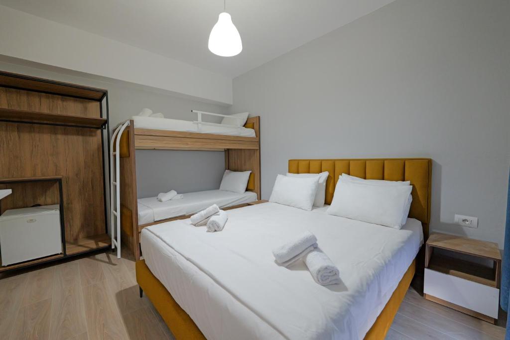 Postel nebo postele na pokoji v ubytování Hotel Holiday