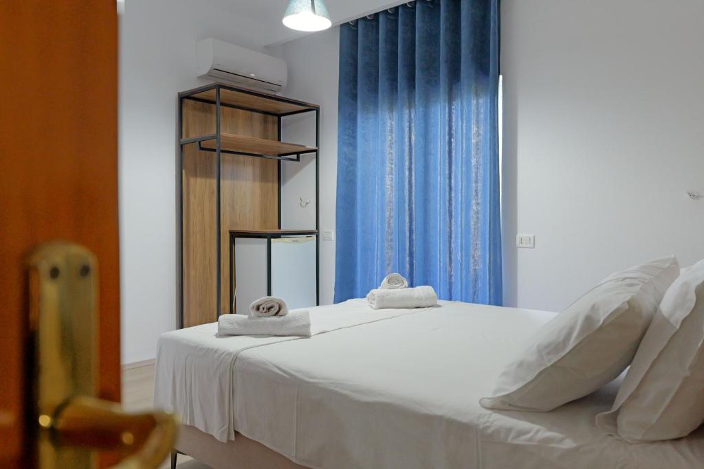 Postel nebo postele na pokoji v ubytování Hotel Holiday