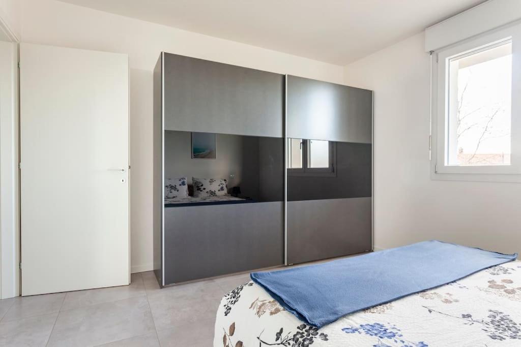 Postel nebo postele na pokoji v ubytování casa MEV è un attico in centro a Fiume Veneto