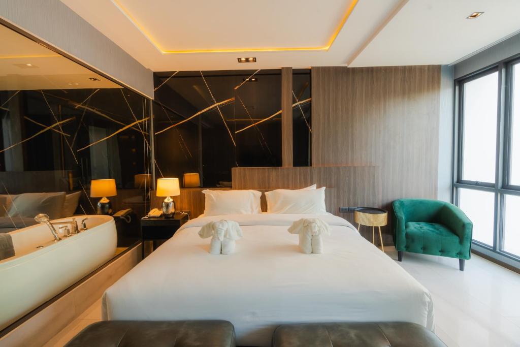 Кровать или кровати в номере Mountain View@nimman12 Hotel & Resort