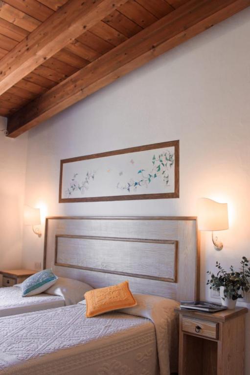 Postel nebo postele na pokoji v ubytování Hotel La Borgata