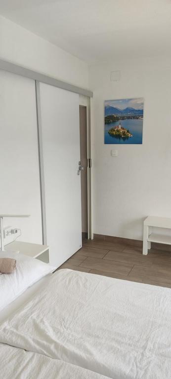Postel nebo postele na pokoji v ubytování Hacienda Bled Rooms