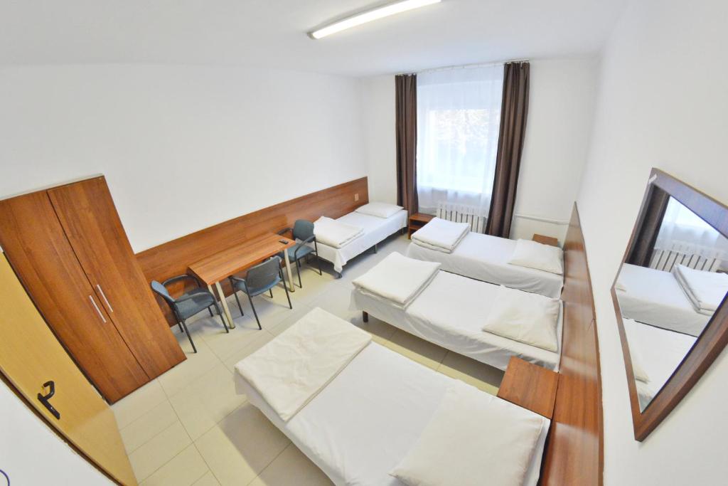 Postel nebo postele na pokoji v ubytování Twój Hostel Klimczoka 7