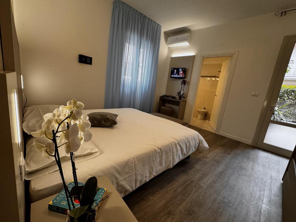 Postel nebo postele na pokoji v ubytování Hotel Etna