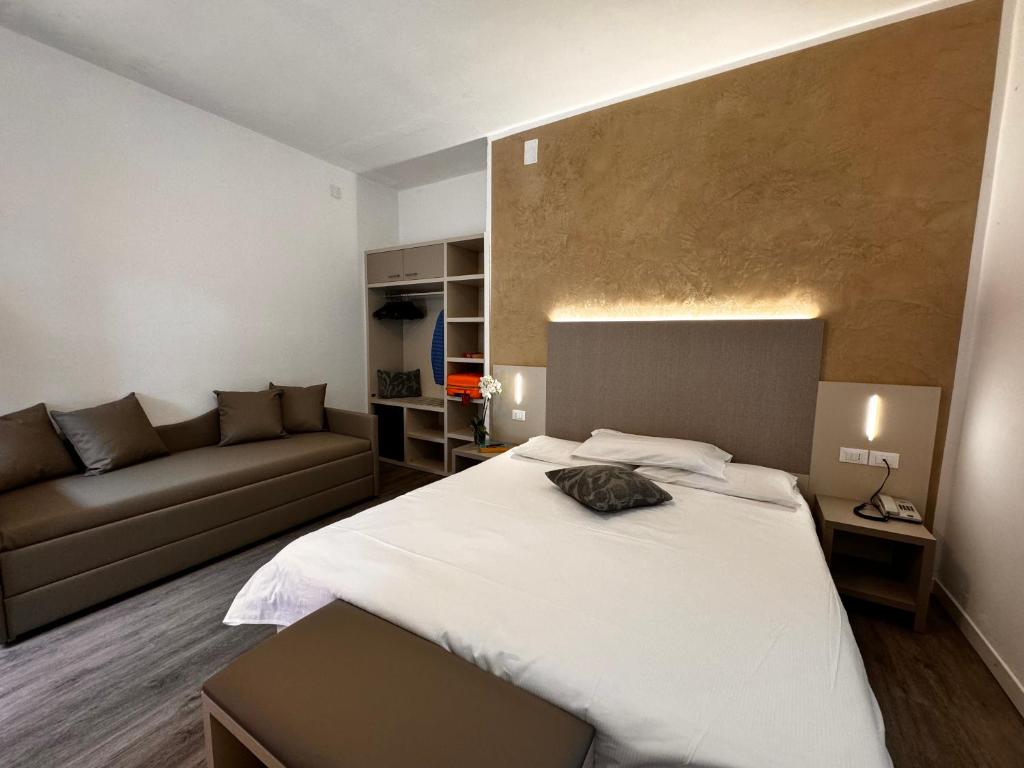 Postel nebo postele na pokoji v ubytování Hotel Etna