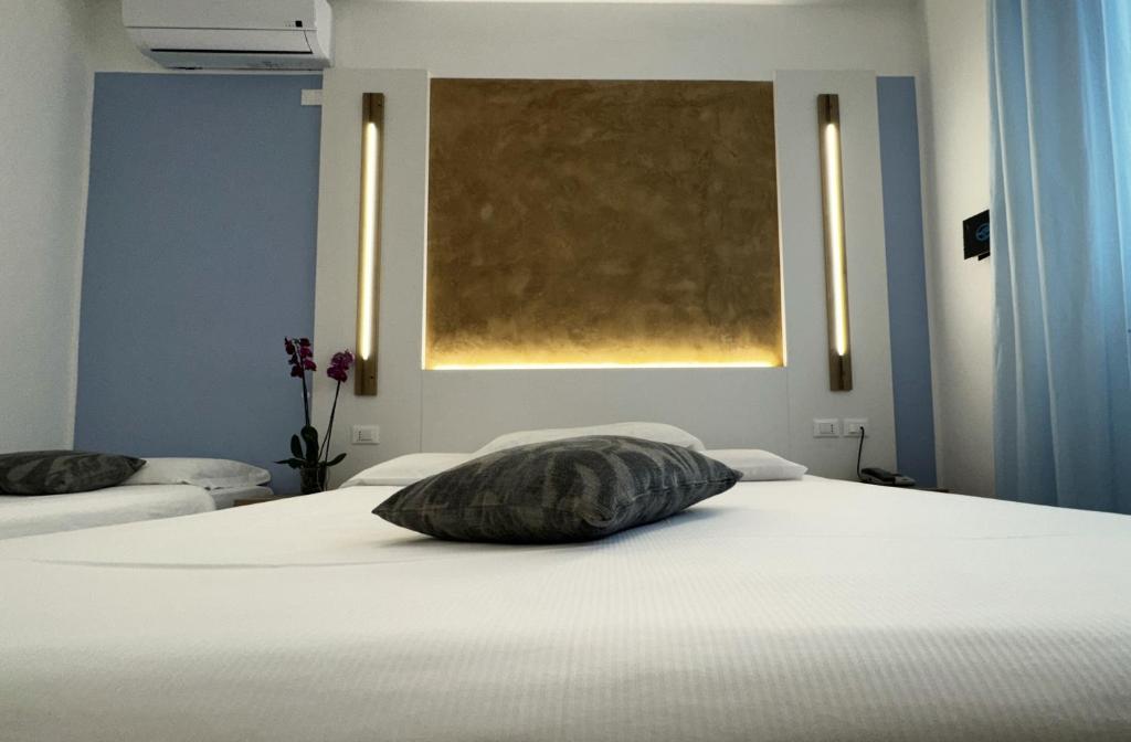 Postel nebo postele na pokoji v ubytování Hotel Etna