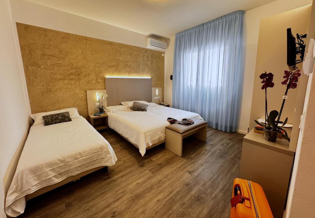 Postel nebo postele na pokoji v ubytování Hotel Etna