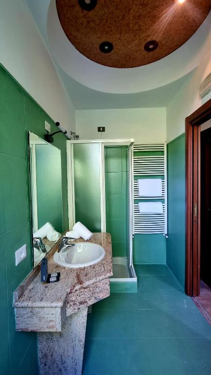 Postel nebo postele na pokoji v ubytování Botanique Hotel Vergani