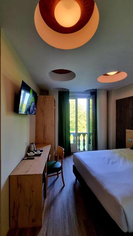 Postel nebo postele na pokoji v ubytování Botanique Hotel Vergani