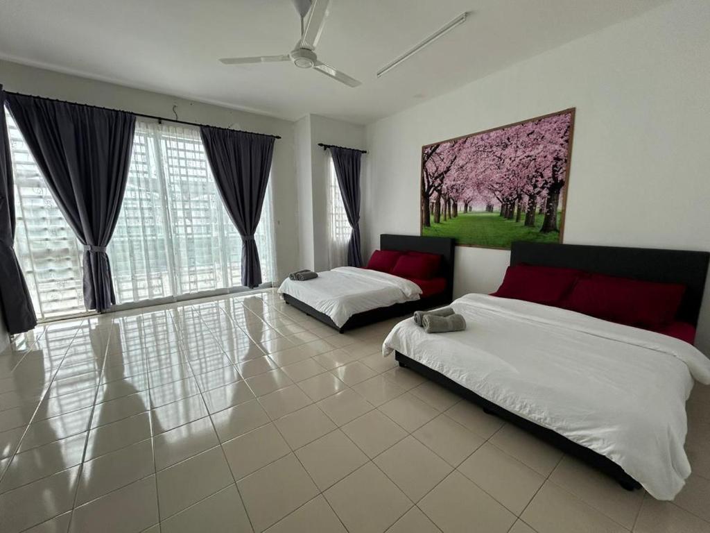 a bedroom with two beds and a large window at Az-zahra Home Stay Kulim Hi-Tech in Kulim