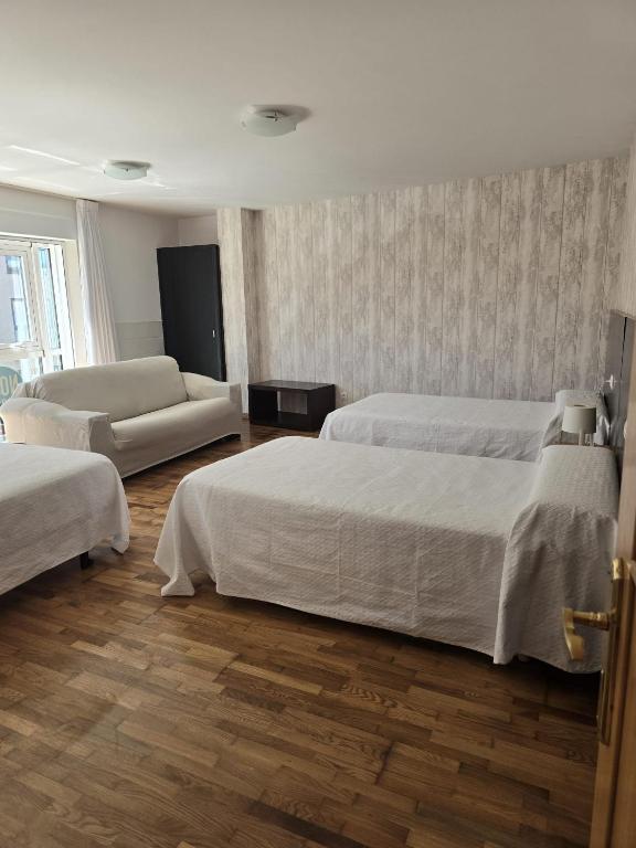 Posteľ alebo postele v izbe v ubytovaní Noja Rooms